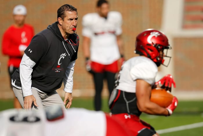 Cincinnati Bearcats head coach Luke Fickell looks over a play during a spring practice at Nippert Stadium in Cincinnati on Thursday, March 24, 2022. Cincinnati Bearcats Spring Practice